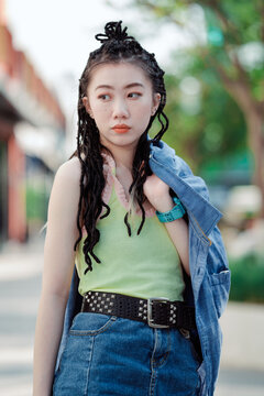 Fashion young Asian woman on city street