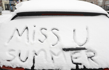car window with text in snow