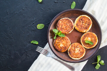 A healthy breakfast of cheese pancakes and honey. Creative atmospheric decoration