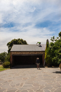 workman on roof