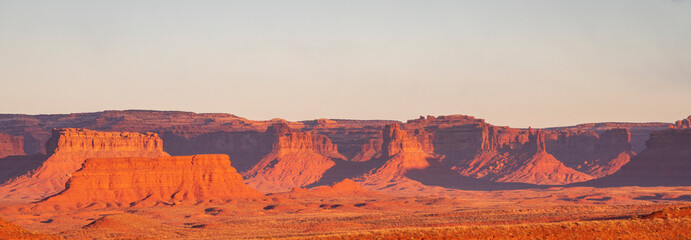 towering mesas and buttes illuminated by the morning light in Valley of the Gods in Utah.
