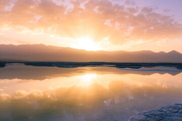 Fototapeta premium Beautiful sunrise over feicui lake in Qinghai province in China.