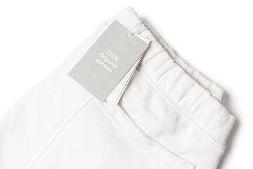 Paper label on a white 100% organic cotton sweatpants