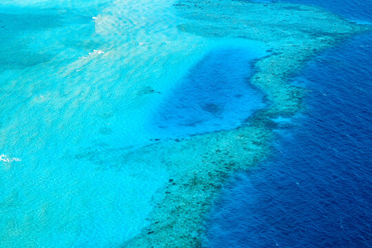 Overlooking The Beautiful Blue Coral Atoll Of The Maldives In The Indian Ocean