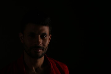 Portrait of a man in darkness