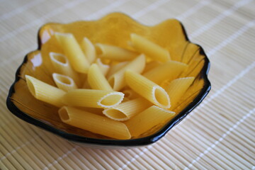 Pasta in a bowl, uncooked 
