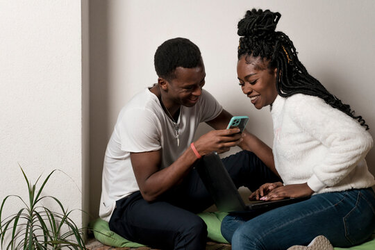 Black Couple using a mobile phone