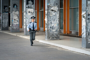 policewoman running through the city streets