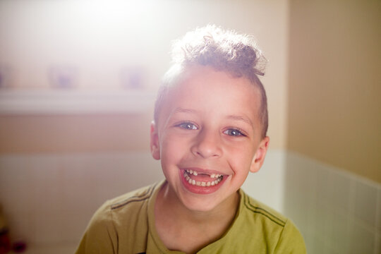  Laughing boy with missing front teeth