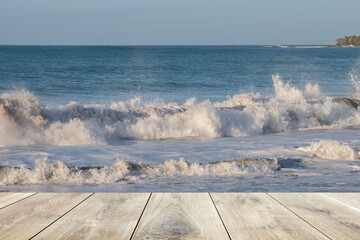 Wooden plank and ocean wave in the background