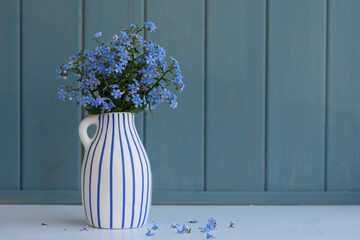 flowers forget-me-nots in a vase