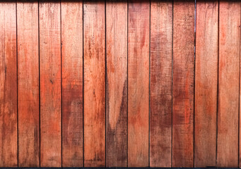 red wooden wall in natue light, texture of plank wall