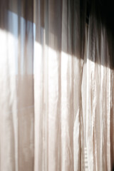 Fototapeta premium Curtains with morning light coming through 