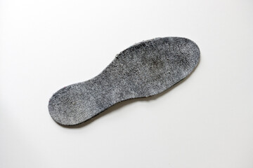 worn felt insole isolated on white