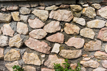 The old stone wall texture.