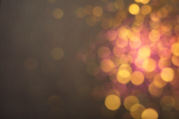 Blurred view of shiny lights on grey background. Bokeh effect
