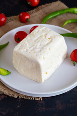 Feta cheese on dark background