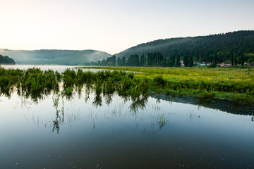 Beautiful rural landscape in Europe, Amazing nature in summer with green fields and blue sky.