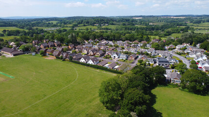 Naklejka premium An aerial view of some parkland with housing and countryside in the background