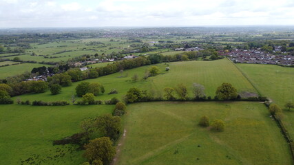 Fototapeta na wymiar An aerial view of some parkland with housing and countryside in the background