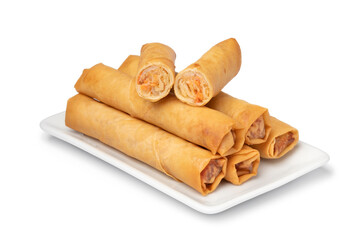 Plate with crispy deep fried Vietnamese egg rolls and a halved one on top isolated on white background 