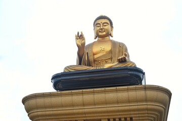 Golden big buddha sculpture of the Fo Guang Shan Buddha Museum.