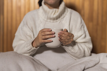 Person holding hot drink coffee 