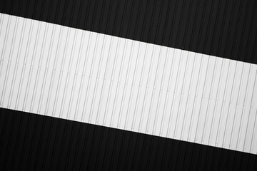 Black and white corrugated iron sheet used as a facade of a warehouse or factory. Texture of a seamless corrugated zinc sheet metal aluminum facade. Architecture. Metal texture.