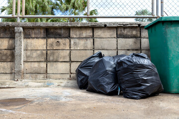 black garbage bag  with old brick wall background