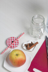 Apple, cinnamon and anise on the table surface. Preparing detox water. From apples, cinnamon and anise. Cooking water infused with apples and spice.