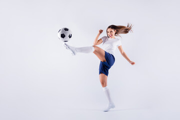 Full length body size view of nice attractive lovely crazy slim sportive cheerful strong straight-haired girl jumping playing kicking ball isolated on light white gray pastel color background