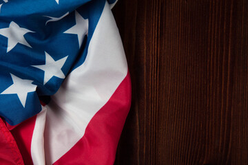 Closeup of American flag on wooden background