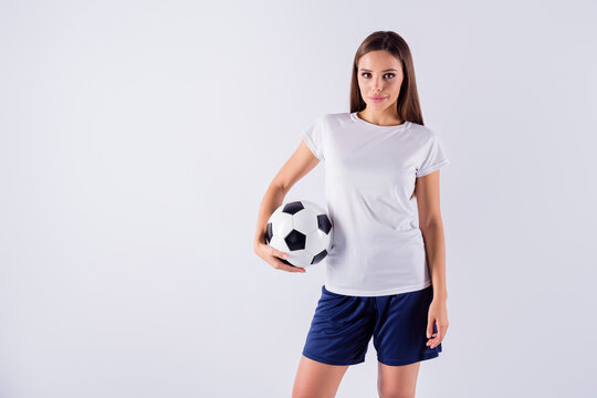 Portrait of her she nice-looking attractive lovely pretty winsome content sportive straight-haired girl holding in hand ball isolated on light white gray pastel color background