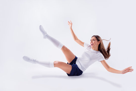 Full length body size view of nice attractive lovely slim overjoyed cheerful cheery straight-haired girl jumping having fun playing world 2020 cup isolated on light white gray pastel color background - Powered by Adobe