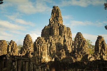 Fototapeta na wymiar General view of the richly decorated Khmer Buddhist temple Bayon, 12th century, in the ancient city of Angkor Thom, near Siem Reap, Cambodia