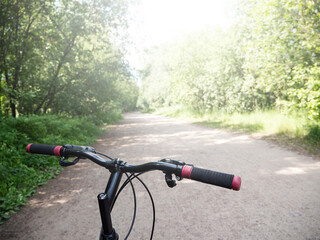Fototapeta na wymiar Mountain bike in the park. Closeup on wheel