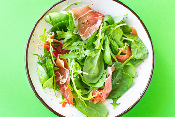 meat salad jamon serrano jerky dry-cured pork green mix leaves vegetable  healthy food meal snack copy space food background rustic top view