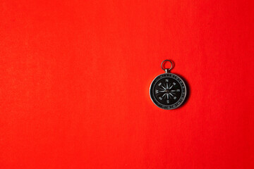 Compass on red background. Concept signs symbols.