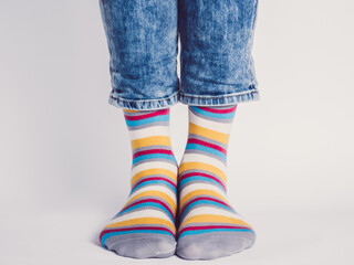 Men's legs and bright socks. Without shoes. Close-up. Style, beauty and elegance concept