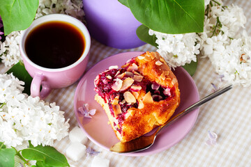 Banner. Cup of hot, morning coffee and lilac. View from above. Copy space for text. The concept of holidays.