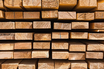a stack of wooden boards, wooden boards at a sawmill, a warehouse of boards on the site of a building materials store. Wood, timber, wood blanks, construction material