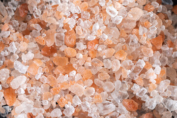 Closeup of Himalayan salt with pinkish , white and transparent crystals used for preparation of tasty meals and other purposes.