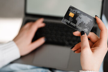 Happy smiling blonde white woman shopping online