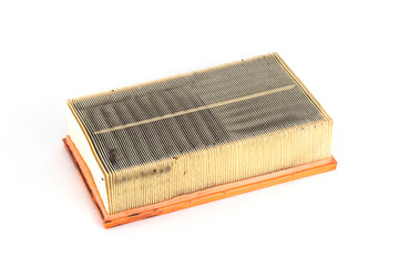 Dirty car air filter on a white background, isolate. The concept of replacing the filter element according to the car maintenance regulations, close-up