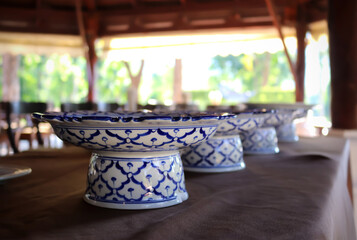 Empty dishes or plates conceptual Thai restaurant plate with pastel blue fine ceramic bowl. Thai style
