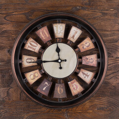 old wooden clock on a wooden wall
