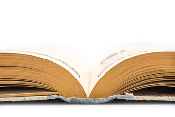 Antique opened book, side view, isolated on white background