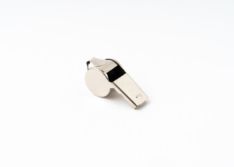 Metal whistle isolated on white background.