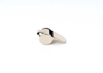 Metal whistle isolated on white background.