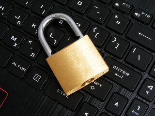 Computer security concept with a closed padlock on the keyboard.
